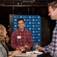 three people mid-conversation